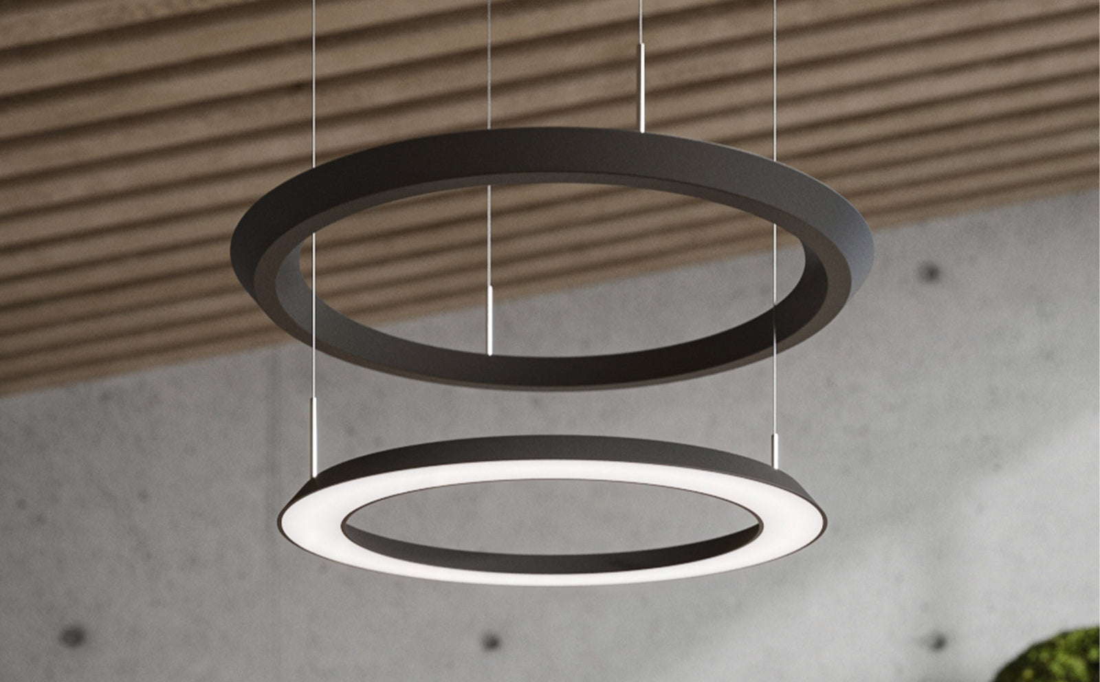 OLIGO YANO Pendelleuchte Schwarz mit zwei Lichtringen über einem Tisch